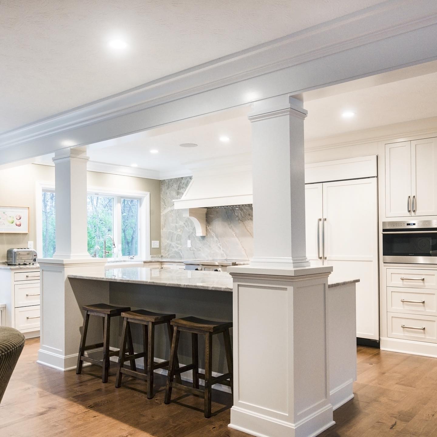 custom kitchen cabinets, support beam, island, trim and crown molding