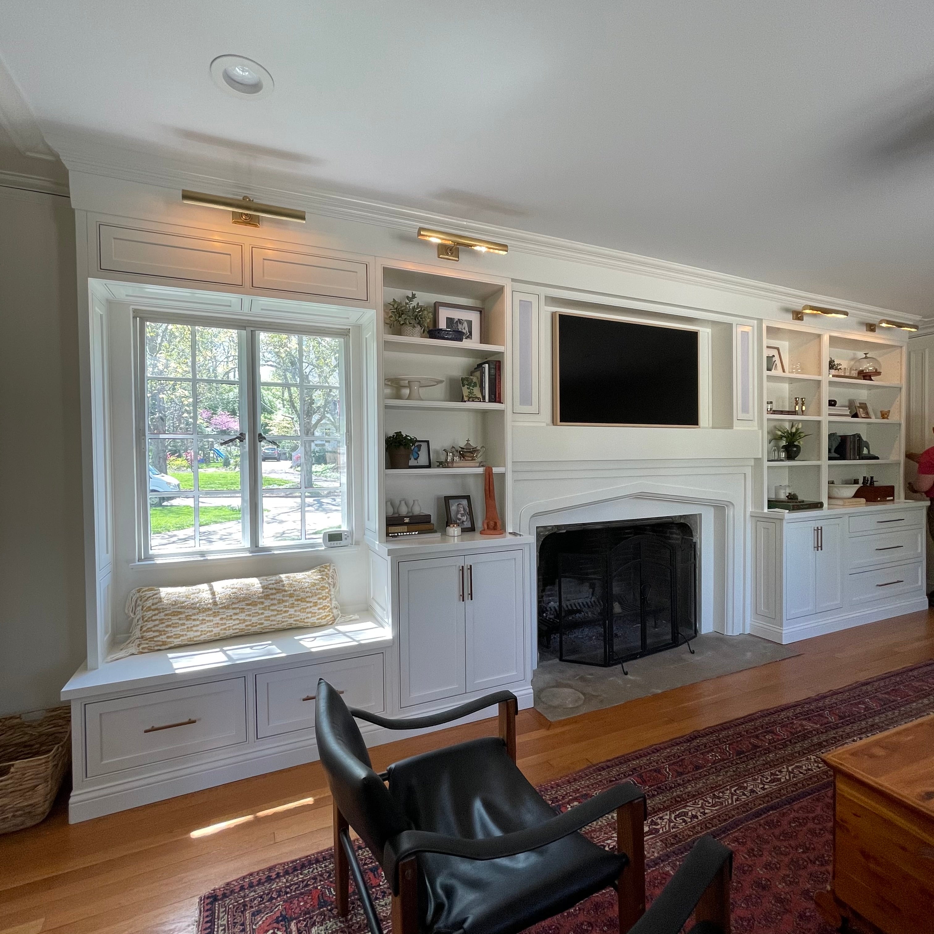 Custom fireplace, built-in and cabinets, wood trim and crown molding